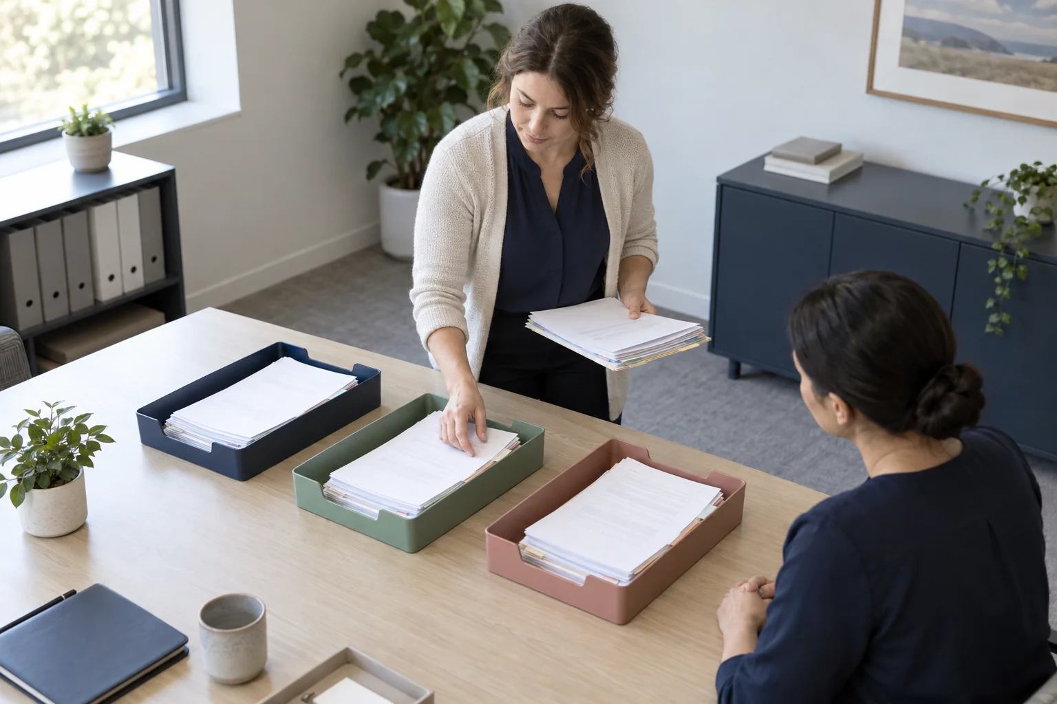 Practice administrators reviewing billing documents